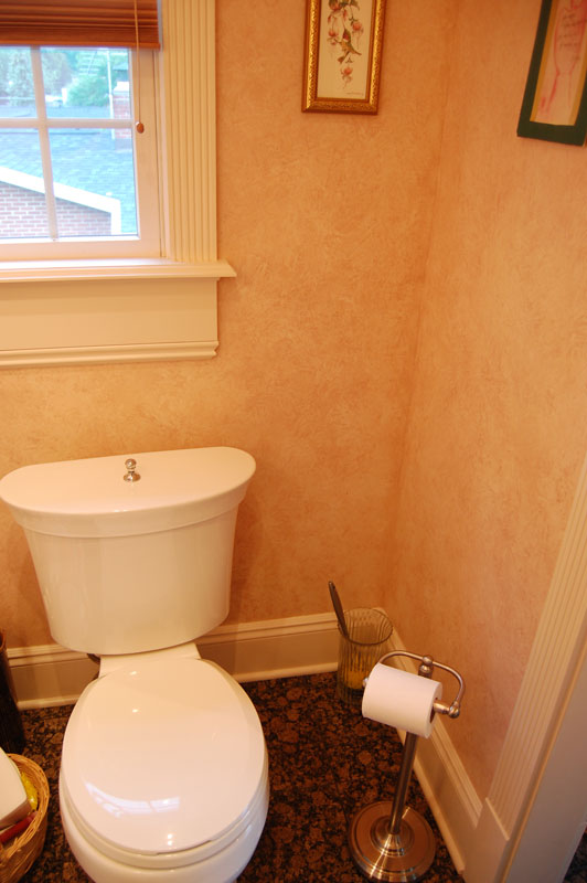 New toilet under window.
