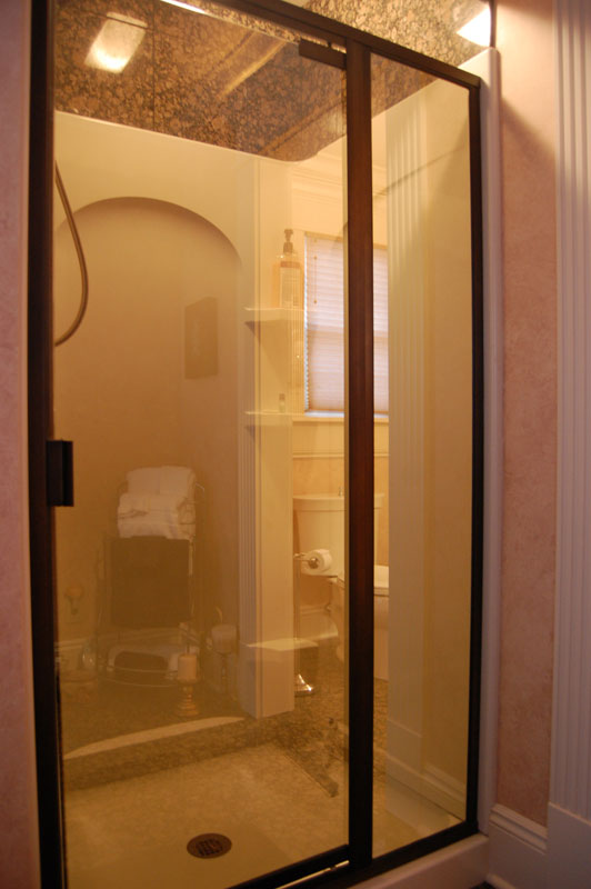 Shower insert with glass doors.