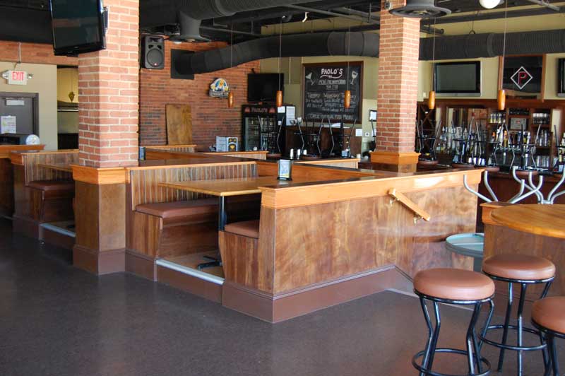 Semi-circular booth with table, from side.
