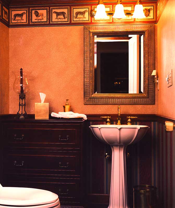 Elaborate bathroom with ornate sink on pedastal.