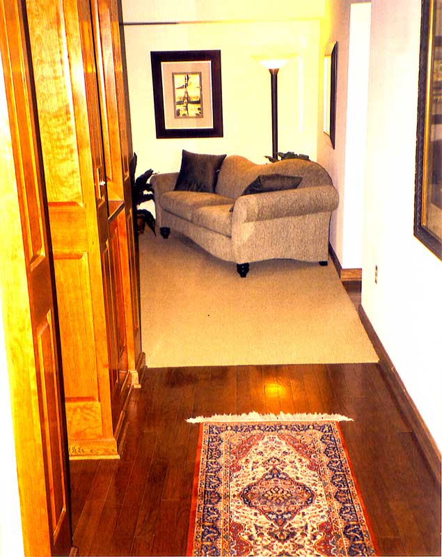 Larbe wooden cabinet in hallway.